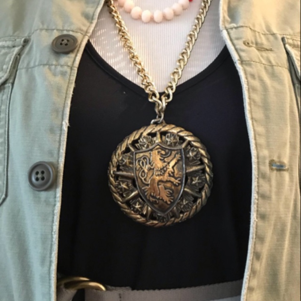 Extra-large lion amulet crest necklace.